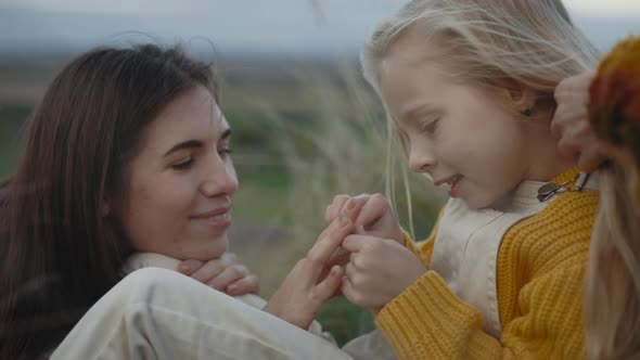 Lgbt Family Spending Free Time with Daughter on Nature alt