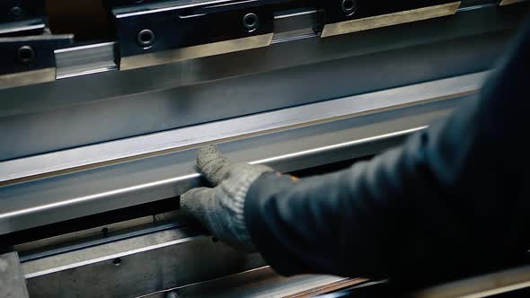 Working in production.Operator working on sheet metal cutting and bending,