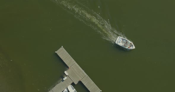 Speed Boat Passing by Boats Anchored on Cold Spring Harbor Long Island alt