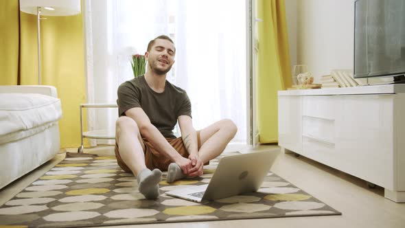 A Young Sporty Man is Smiling and Posing for a Camera alt