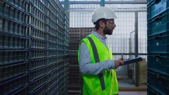 Man Warehouse Worker Checking Boxes Examining Shipment Package Inspecting alt