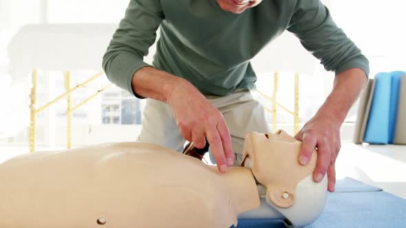 Male paramedic during cardiopulmonary resuscitation alt