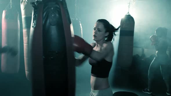 Group of Boxers Training in a Group. Female in the foreground