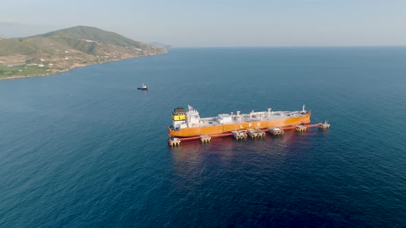 A gas tanker is anchored at sea aerial view 4 K alt