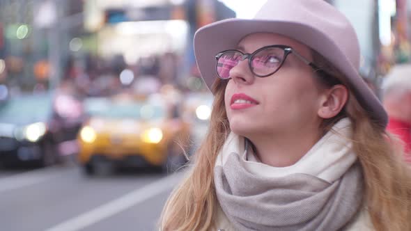 Girl At Time Square in New York alt