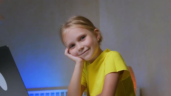 Portrait of a Little Schoolgirl Smiling
