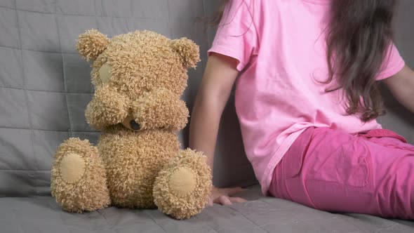 Holding with care plush toy.  alt