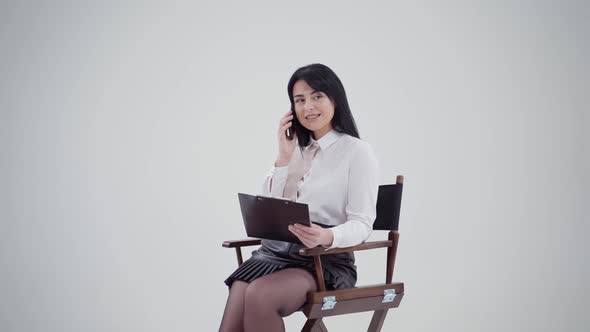 Brunette girl talking the phone isolated in studio alt