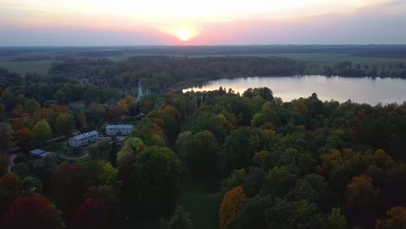 Stameriena Palace, Stameriena Lake at Sunset Aerial View in Autumn, Orthodox Church in Background. alt