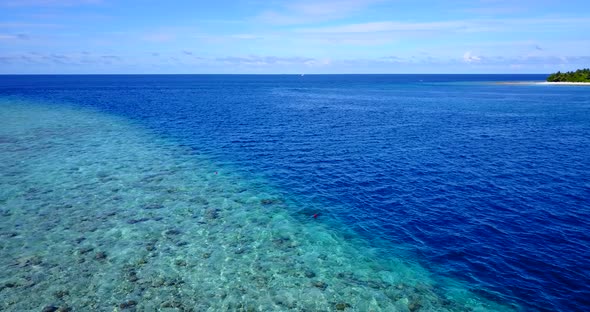 Natural drone abstract shot of a white paradise beach and blue sea background in high resolution 4K alt