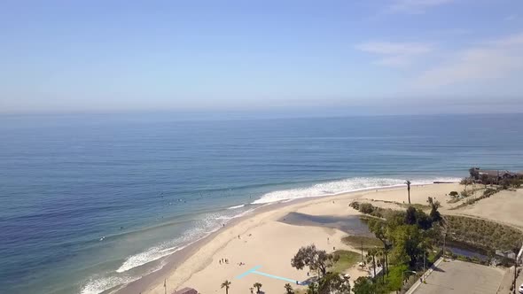 Slow motion of the Most famous surfer sport in Malibu.Gorgeous aerial view flight panorama overview alt