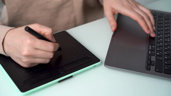 Women's Hands Closeup Drawing on Graphic Tablet Remote Creative Work Online alt