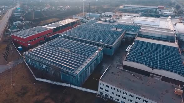Top view of solar farm on the industrial buildings alt