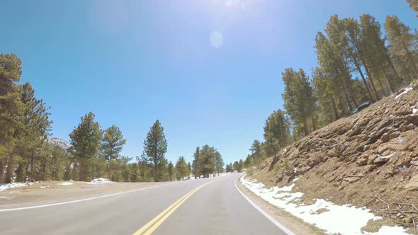 POV point of view -Driving through Rocky Mountain National Park in the Spring. alt