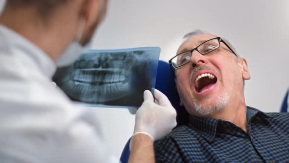 Male Patient of Dental Clinic During Doctor Regular Checkup alt