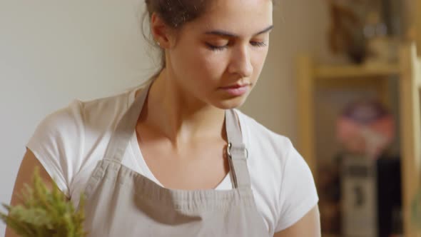 Beautiful Florist Putting Together Dried Grass alt