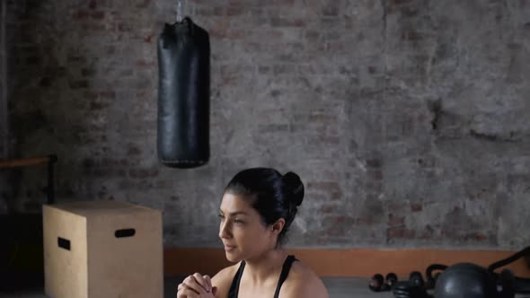 Young Indian Athletic Woman Doing Sports Doing Squat Exercise Dressed in Sportswear Black Top alt