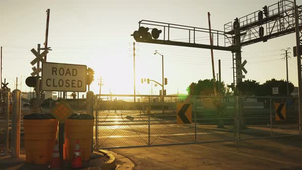 Evening Sunset In Urban Area With Golden Sunshine On Closed Road. alt