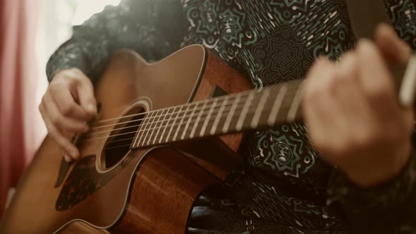 Crop Guy Playing Acoustic Guitar