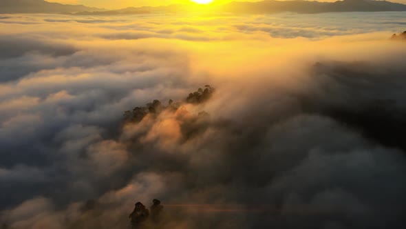 Time lapse Aerial view of drone. Scene of sunrise cloud movements in morning sky.A sea of fog is fo alt