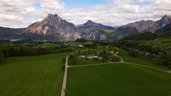 Beautiful view on the Mountains, lake and a Village Drone Video alt