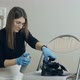 Woman Spraying Cleaning Liquid on Her Shoes - VideoHive Item for Sale