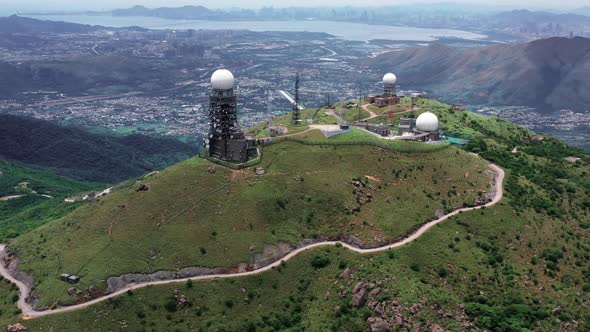 Aerial view of Sun rising at the tallest mountain Tai Mo Shan in Hong Kong with colorful blue sea an alt
