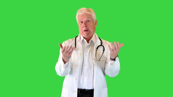 Elderly Male Doctor Arguing on Camera on a Green Screen Chroma Key alt