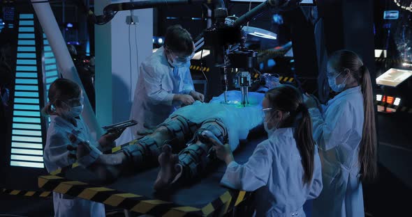 Young Scientists Make an Autopsy of an Alien Take a Sample of the Material