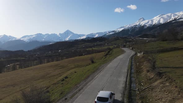 Caring next to the mountains in Europe. Drone shot of Georgia peaks, Cavkaz. alt