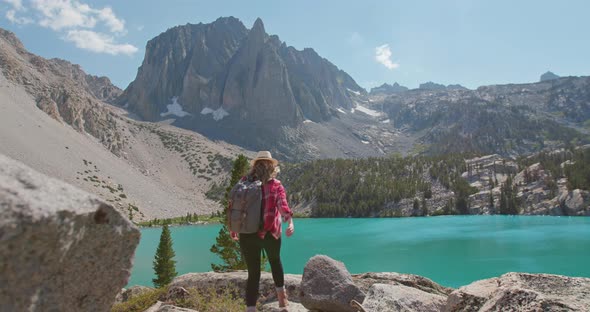 Hipster Millennial Young Woman Is Running By Top of Mountain Summit alt