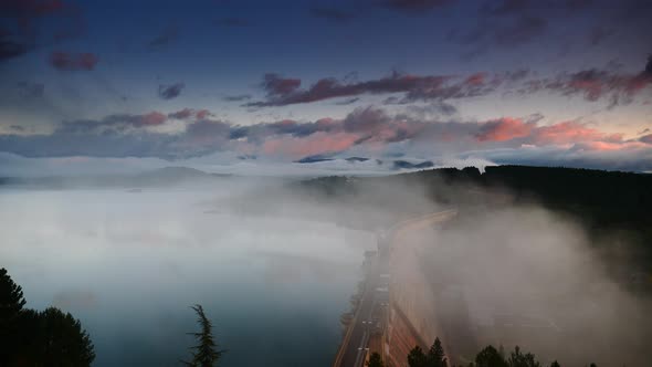 Morning Fog over Dam on Embalse de Aguilar de Campoo, Spain. alt