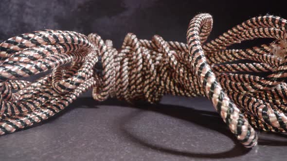 Bunch of Clothesline Lies on Dark Grey Stone Table alt