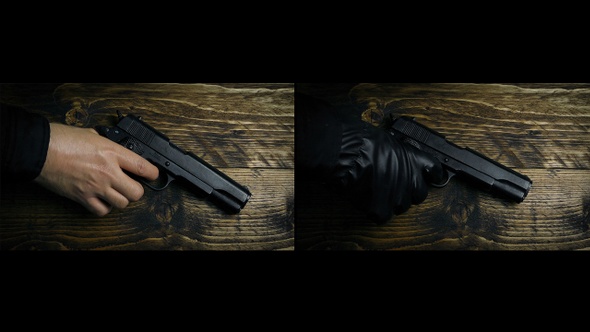 Gun Picked Up By Hand And Gloved Hand alt