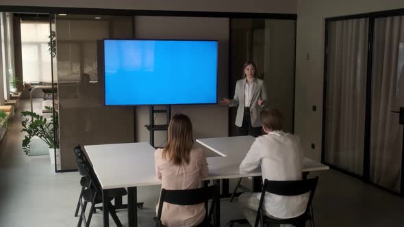 Diverse office conference room meeting female project manager use Chroma Key wall mounted alt