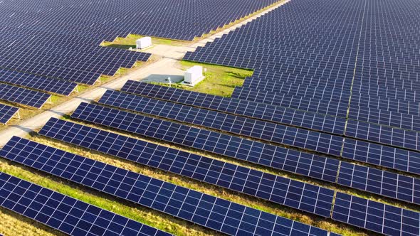 Aerial Drone View Flight Over Solar Power Station Panels alt