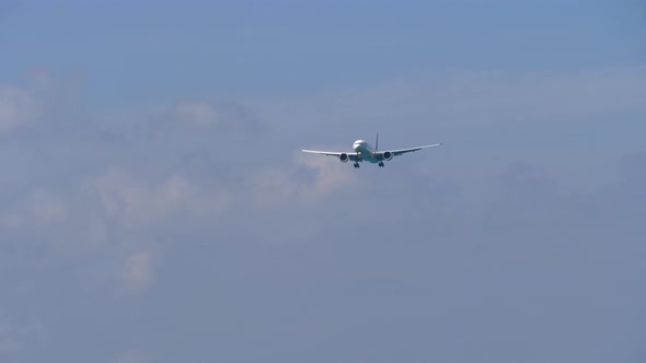 Airplane Approaching Over Ocean alt