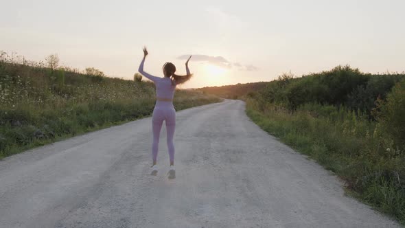 Girl Jumps and Turning Around of a Fresh Air