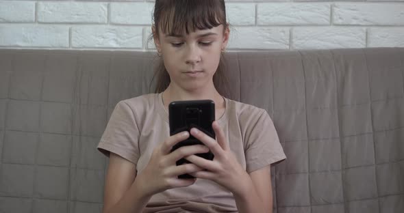 Teen Using Smartphone Device at Home alt