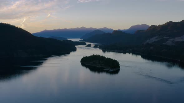 Beautiful sunset over the river and mountains of Canada - aerial alt