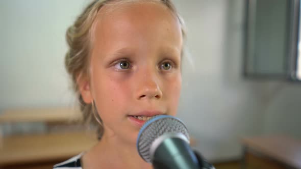 Seven Year Old Girl Practices Vocal