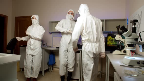 Youngs Scientists Dancing in Laboratory