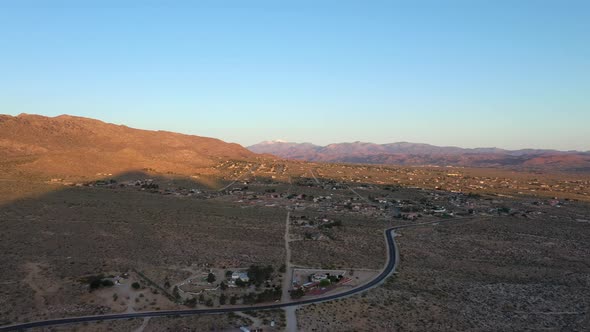 Asphalt Road Leading To St. George City Community At Daytime In Utah, USA. - aerial alt