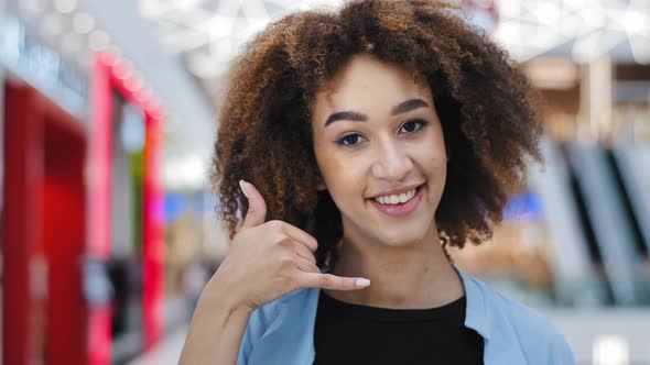 Female Portrait Indoors Happiness Contented African American Curly Woman Girl Showing Direction to alt
