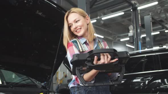 Good Looking Woman in Uniform Writing Something on a Computer alt