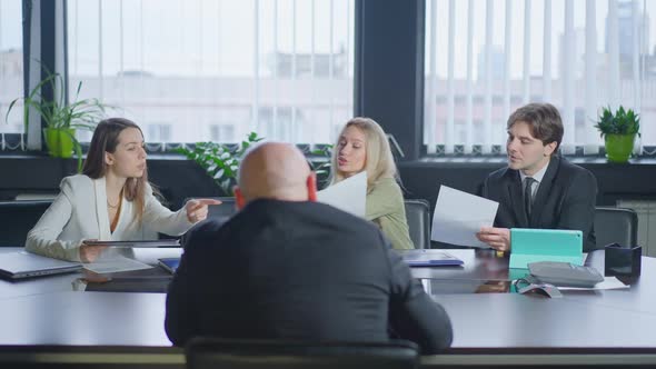 Group of People Discussing Business Project Idea Sitting in Office As Man Entering alt