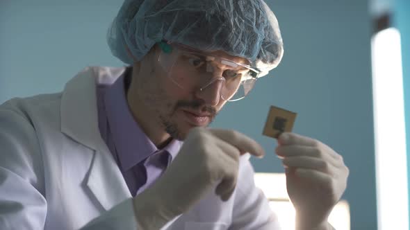 The Engineer Holds a Computer Processor