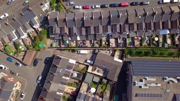 Rows of identical houses in suburban neighborhood, Exeter, UK, Aerial Zoom Out alt