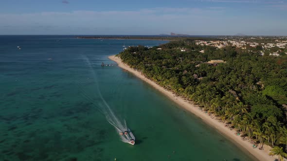 Beach Along the Waterfront and Coral Reef and Palm Trees, Mauritius, Africa, Pier Near the Beach of alt