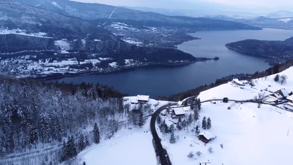 Beautiful Aerial Drone Shot on a Winter Sunny Day with Snow Close to the Lake